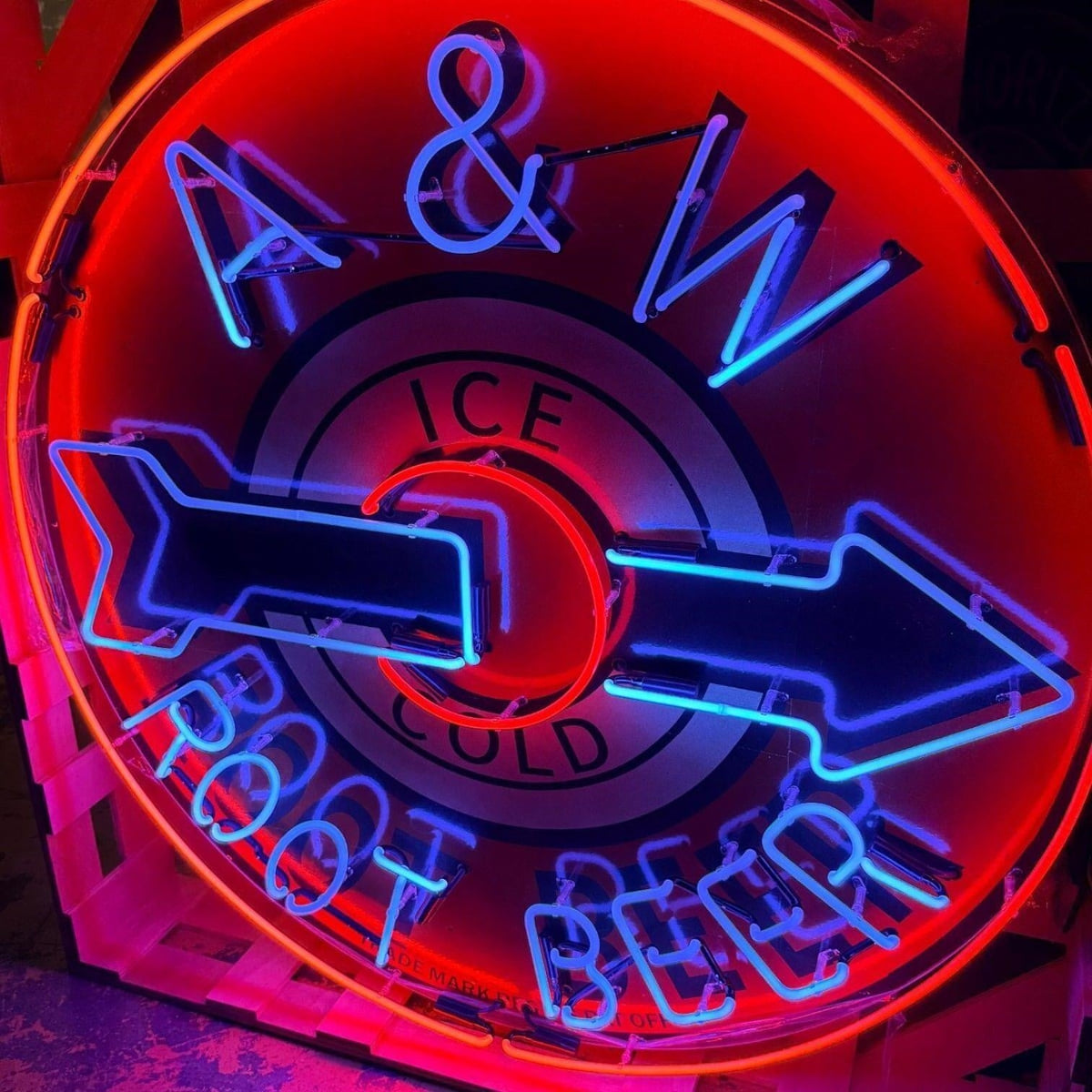 Actual catalog photograph of an illuminated round A&W Ice Cold Root Beer advertising display in red, blue, and white neon