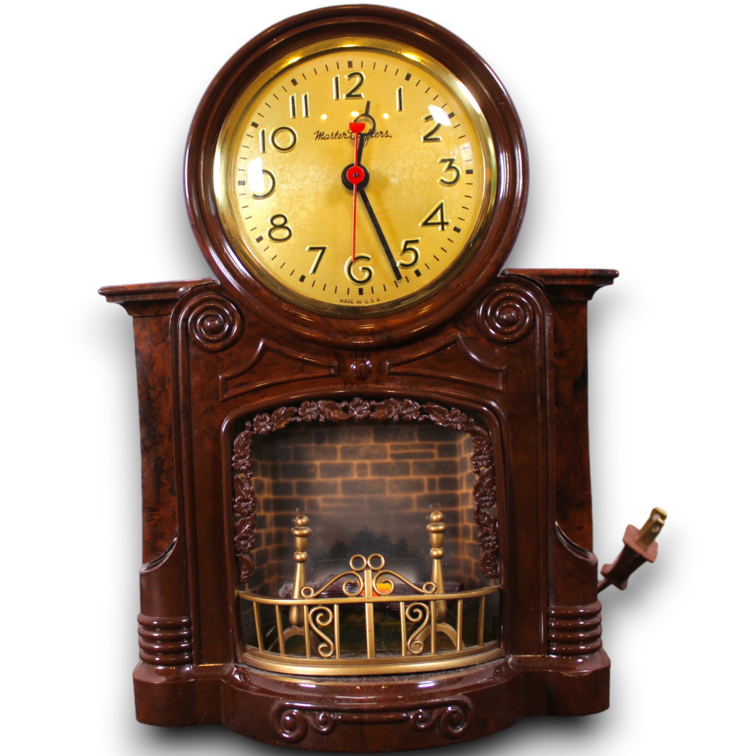 Catalog photograph of a novelty clock designed in the shape of a small fireplace