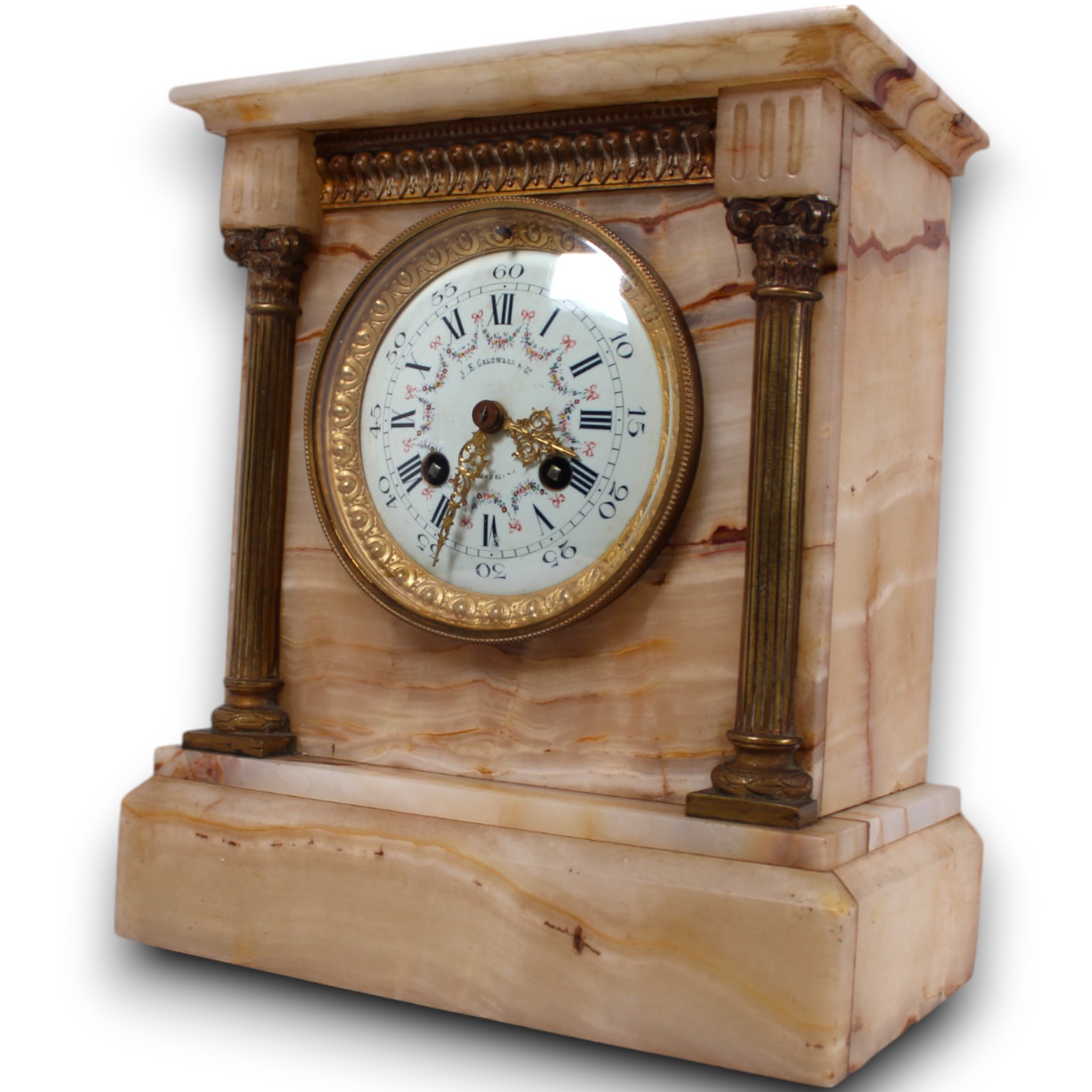 Ornate pale-stone mantel clock with gold-toned details