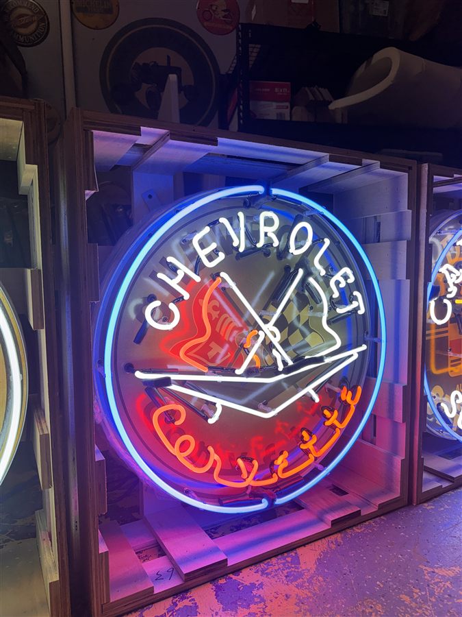 Modern reproduction Corvette-branded neon display photographed for an auction catalog