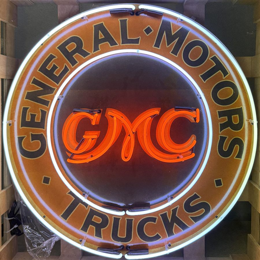 Modern reproduction GMC-branded neon display photographed for an auction catalog